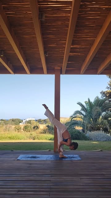 Yoga inversion by the sea